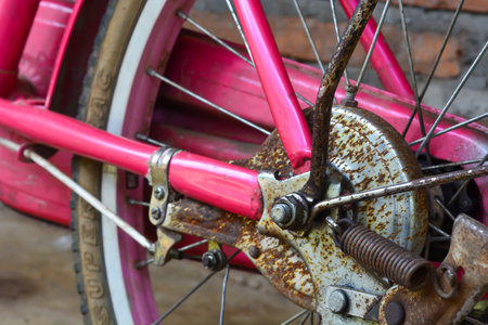 May 29, 2023. An old pink bicycle, lying on the porch of the house. Indonesiaの写真素材