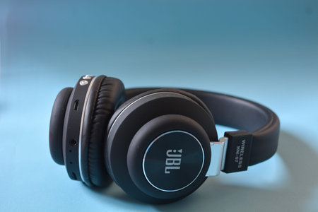 May 2023, Wonosobo Indonesia: Black headphones on a blue background.