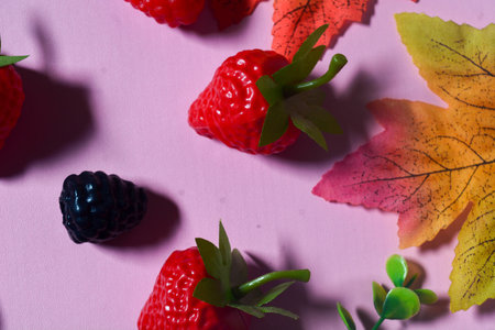 Isolated Blueberry, Blackberry and Strawberry fruit. Against a pink backgroundの写真素材