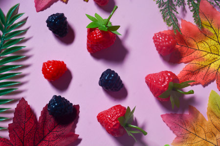 Isolated Blueberry, Blackberry and Strawberry fruit. Against a pink backgroundの写真素材