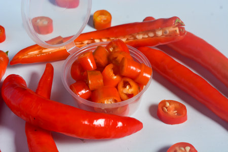 Scene of the red chili which looks very hot against a white background. No people.の写真素材