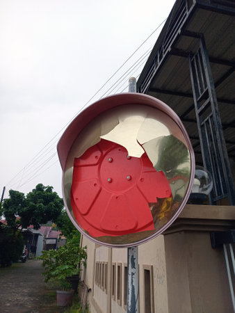 A damaged convex mirror showing cracks and broken partsの写真素材