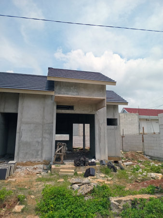 A construction site with a partially built modern houseの写真素材