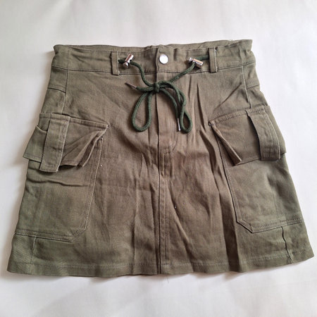 Utility style skirt featuring cargo pockets and adjustable waist drawstring tieの写真素材
