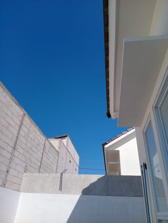 Modern residential architecture with clear blue sky.
