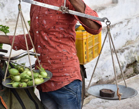 Karakbel, Madhya Pradesh/India : September 5, 2020 - A man selling vegetable on a bicycle in a villageのeditorial素材