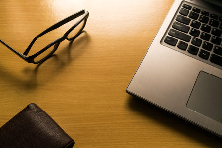 Laptop,Glasses and Walletの写真素材