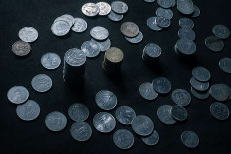 Indian currency coins on black backgroundの写真素材
