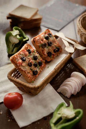Food Photograph of Bread pizzas with other ingredients on the tableの写真素材