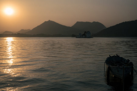 Sunset scene at a lake with mountains in the background