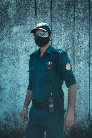 Portrait of a security guard in a protective mask and cap.の写真素材
