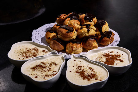 Presentation and plating of rice pudding in individual pear-shaped bowls and homemade chocolate...
