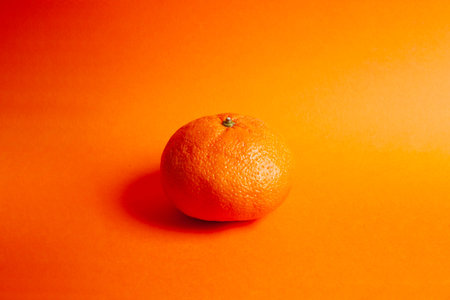 orange isolated on orange background. Organic fruit.の写真素材