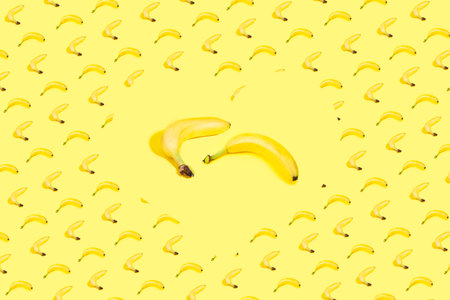 bananas pattern on yellow backgroundの写真素材