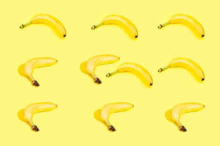 bananas pattern on yellow backgroundの写真素材