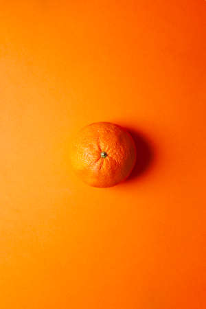 orange isolated on orange background. Organic fruit.の写真素材