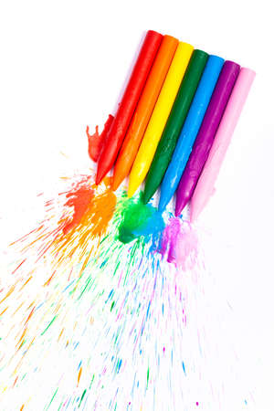 rainbow colored school crayons with burst ink. Concept art.の写真素材