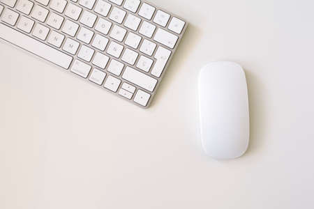 minimalistic top view of white keyboard and mouse with white backgroundのeditorial素材