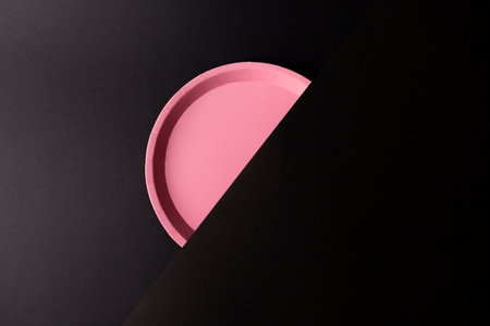 Clean and minimalist pink color design with black backgroundの写真素材