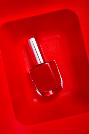 red nail polish top view background on red background