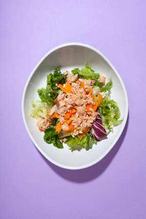 top view salad plate with purple background with copy spaceの写真素材