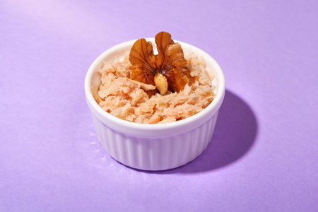 front view of tuna snack with walnut with purple background and copy spaceの写真素材