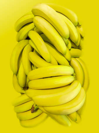 bunch of bananas on yellow backgroundの写真素材