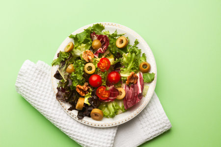 top view of vegan vegetable salad on green backgroundの写真素材