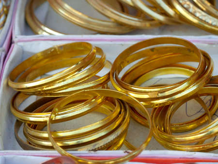 Display of Colorful Bangles for wearing in hand by women, female, girls in India.の写真素材