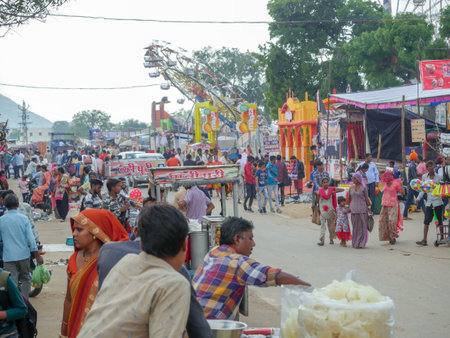 Pushkar, Rajasthan / India - November 5, 2019 : Indiaâs biggest cattle and culture fair âpushkar camel fairâ, village people visiting stalls, doing shopping in market and enjoying.のeditorial素材