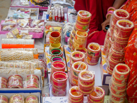 Display of Colorful Bangles for wearing in hand by women, female, girls in India.のeditorial素材