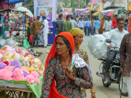 Pushkar, Rajasthan / India - November 5, 2019 : Street market in rural India. Crowded busy Street...
