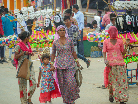 Pushkar, Rajasthan / India - November 5, 2019 : Street market in rural India. Crowded busy Street with men and women walking in Rural Indian Town at Pushkar city Indiaのeditorial素材
