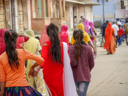 Pushkar, Rajasthan / India - November 5, 2019 : Street market in rural India. Crowded busy Street with men and women walking in Rural Indian Town at Pushkar city Indiaのeditorial素材