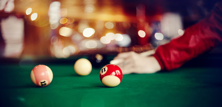 Colorful billiard balls on a green billiard table. Gambling game of Billiards.の写真素材