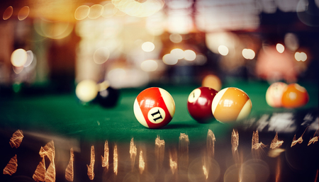 Colorful billiard balls on a green billiard table. Gambling game of Billiards.の写真素材