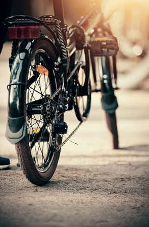 The rear wheel of the yellow sports bike. Sports bike ride in the Park. Outdoor activity.の写真素材