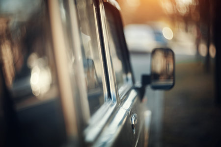 Car door, window and mirror. Background with the side surface of the car.