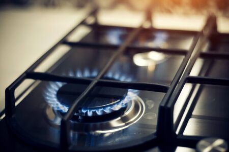 Kitchen modern gas cooker with burning fire propane gas. Gas stove.の写真素材