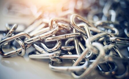 Close-up of a shiny metal chain. Chain links.の写真素材