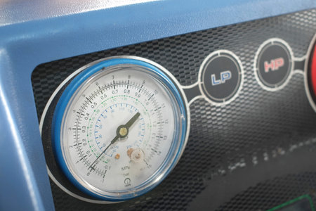 Manometer gages on equipment for filling automotive air conditioners.