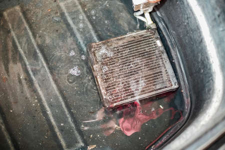 Cooling coil  in the water. Checking for leaks.の写真素材