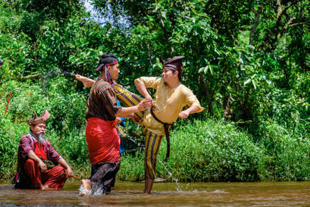 Kuantan, Malaysia - October 21st, 2017 : Two Malay men with the traditional malay warrior costume performing martialのeditorial素材