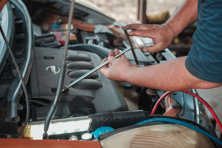 Segamat, Malaysia - November 11th , 2017 : Automobile air-conditioner servicing. Mechanic uninstall cooling coil and filter  in the old car.のeditorial素材