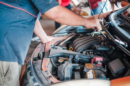 Segamat, Malaysia - November 11th , 2017 : Automobile air-conditioner servicing. Mechanic uninstall cooling coil and filter  in the old car.のeditorial素材