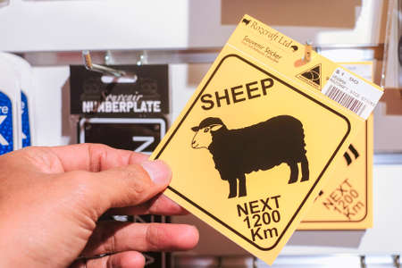 Christchurch, New Zealand â December 19th, 2017 : Sheep crossing signs souvenir in DP Souvenir shop in Christchurch, New Zealand.ale in DF Souvenir.のeditorial素材