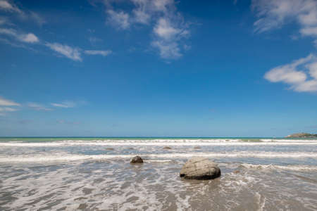Moeraki Boulders. Rock formations  on the beach in the afternoon light, Moeraki Beach, Hampden, Otago Region, New Zealandの写真素材