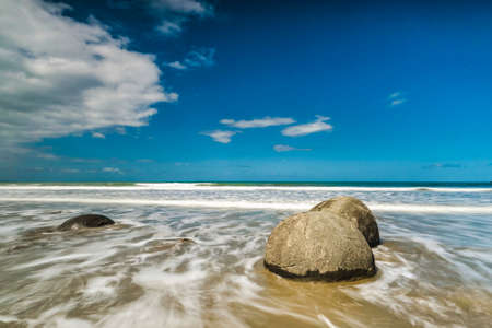 Moeraki Boulders. Rock formations  on the beach in the afternoon light, Moeraki Beach, Hampden, Otago Region, New Zealandの写真素材