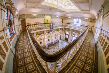 Dunedin, New Zealand â December 18th, 2017 : The interior of Dunedin Railway Station completed in 1907 and featuring a Royal Doulton mosaic floor with decorative wrought iron railings running around the gallery aboveのeditorial素材
