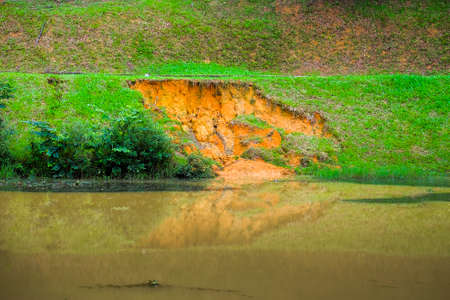 Soil erosion or landslide on the lake in the rainy season at Muadzam Shah, Malaysia.の写真素材